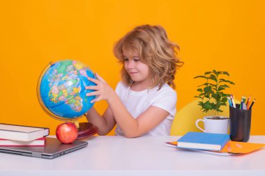 School child portrait isolated on yellow studio background. Kid boy from elementary school. Pupil go study. Clever schoolboy learning. Kids study, knowledge and education