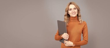 Woman portrait, isolated header banner with copy space. network administrator hold computer. friendly looking office manager. concept of agile business