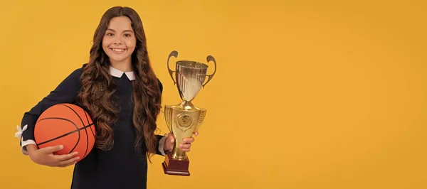 Glad Child Hold Basketball Ball Champion Cup Yellow Background Victory — Zdjęcie stockowe