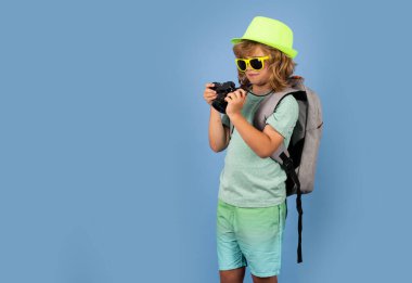 Kid on travel, isolated studio portrait. Child travel and adventure concept