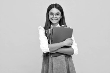 School child with book. Learning and education. Happy schoolgirl face, positive and smiling emotions