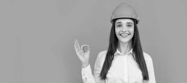 Woman isolated face portrait, banner with mock up copy space. businesswoman in builder hardhat. chief architect engineer. entrepreneur in protective helmet