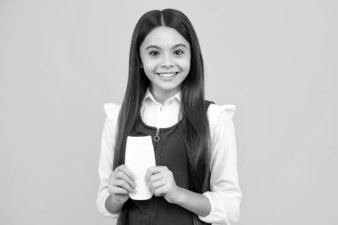 Teenage girl with shampoos conditioners or shower gel. Kids hair care cosmetic product, shampoo bottle