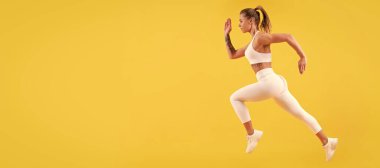fitness woman runner running on yellow background. Woman jumping running banner with mock up copyspace