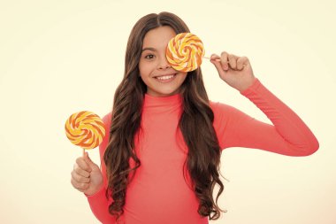 Teenager girl with caramel candies on sticks, sweet sugar addiction. Child with lollipops. Happy girl face, positive and smiling emotions