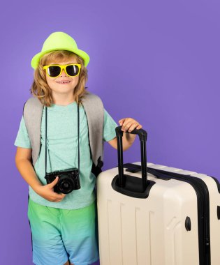 Kid on travel, isolated studio portrait. Child travel and adventure concept