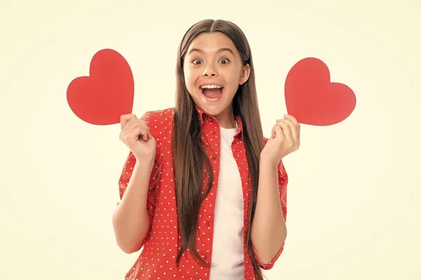 stock image Lovely child girl 12, 13, 14 years old with shape heart love holiday and valentine symbol. Valentine or birthday day. Portrait of emotional amazed excited teen girl