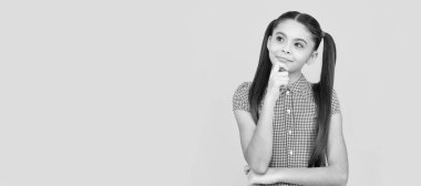Start thinking big. Thoughtful girl yellow background. School age child keep thinking. Child face, horizontal poster, teenager girl isolated portrait, banner with copy space