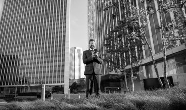 professional ceo working online. typing and texting. sms and instant messaging. happy businessperson chat online. agile business blogging. modern communication technology. man blogger use smartphone.