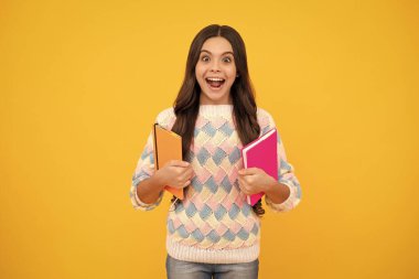 Excited face. Back to school. Portrait of teenage school girl with books. Children school and education concept. Schoolgirl student. Amazed expression, cheerful and glad