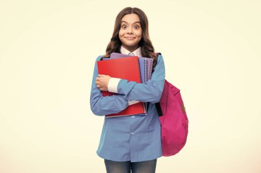 School teenager child girl with school backpack hold book and copybook. Teenager student, isolated background. Learning and knowledge. Go study