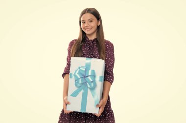 Teenager child with gift box. Present for holidays. Happy birthday, Valentines day, New Year or Christmas. Kid hold present box. Portrait of happy smiling teenage child girl