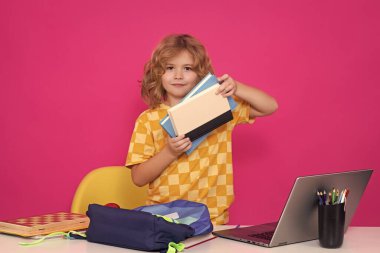 Back to school. Funny little boy from elementary school with book. Education