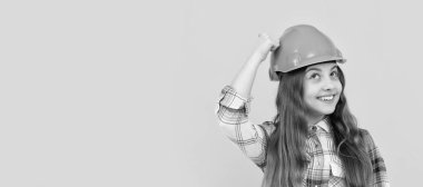 Engineer teenager girl. Funny teen girl in helmet and checkered shirt, build. Child in hard hat horizontal poster design. Banner header, copy space