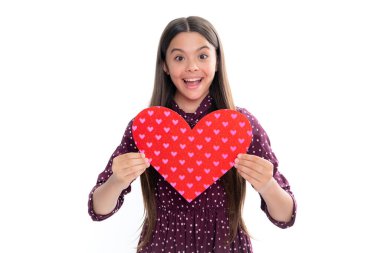 Lovely child girl 12, 13, 14 years old with shape heart love holiday and valentine symbol. Valentine or birthday day. Portrait of emotional amazed excited teen girl