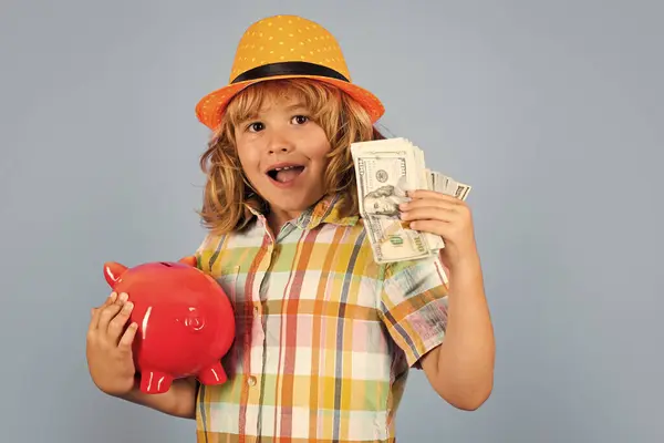 Cash money dollars bills and piggy bank concept. Child saving money in a piggy bank, learning about saving, Kid save money in piggybank