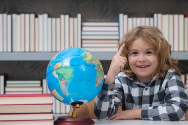 Back to school. Funny little child from elementary school with book. Education. Kid study and learning