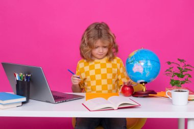 Back to school. Portrait of cute child school boy. School and education kids concept. Clever kid with school supplies