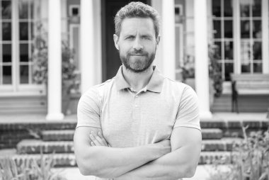 happy bearded man real estate agent selling or renting house, for sale.