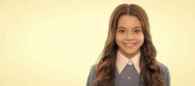 cheerful kid with curly hair. beauty and fashion. female fashion model. Child face, horizontal poster, teenager girl isolated portrait, banner with copy space