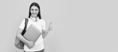Woman isolated face portrait, banner with copy space. woman with school bag hold laptop. buy online. back to school. thumb up