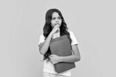 Teenager school girl study with books. Learning knowledge and kids education concept. Thinking pensive clever teenager girl