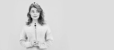 surprised redhead woman in queen crown with magic wand, magic. Woman isolated face portrait, banner with copy space
