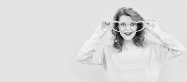 Girl with funny party glasses. Woman isolated face portrait, banner with copy space. happy redhead woman in party glasses. just having fun. funny girl wear big glasses