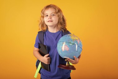 School boy world globe and tablet. Smart caucasian school boy kid pupil student going back to school. Education kids