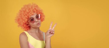 having fun. child wear sunglasses and swimsuit. teen girl with orange hair. summer beach fashion. Funny teenager child on party, poster banner header with copy space