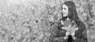 Autumn fall woman banner with copy space. beautiful face portrait. natural beauty. fall season fashion. girl enjoy weather with autumn leaves