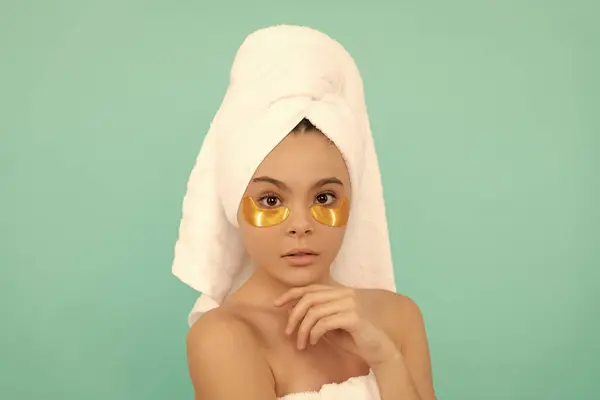 stock image teen girl in shower towel with beauty patch.