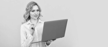 busy businesswoman in white shirt work online with laptop on yellow background, entrepreneur. Woman isolated face portrait, banner with mock up copy space