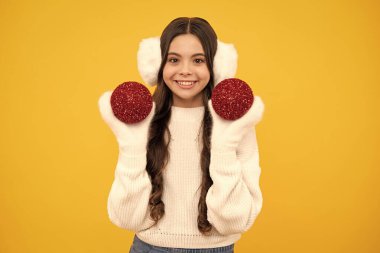 Santa girl in fur sweater isolated on yellow background. Happy New Year, Kids winter holiday concept