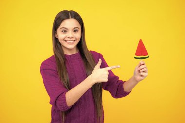 Teenage girl with lollipop, child eating sugar lollipops, kids sweets candy shop