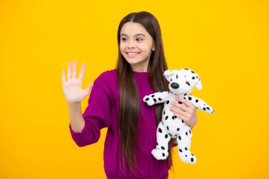 Childhood, toys and kids. Cute teen girl cuddling fluffy toy