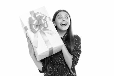 Teenager kid with present box. Teen girl giving birthday gift. Present, greeting and gifting concept. Portrait of emotional amazed excited teen girl