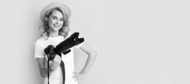 Woman isolated face portrait, banner with mock up copy space. happy girl hold photo camera. amateur and professional photography. summer shooting session