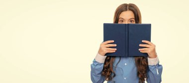 School kid hide face with book isolated on white, library. Horizontal isolated poster of school girl student. Banner header portrait of schoolgirl copy space