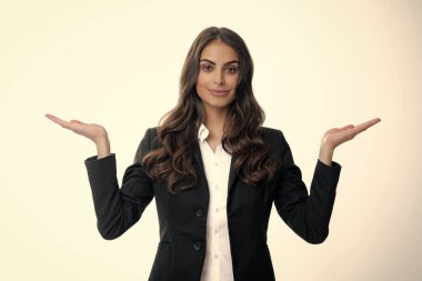 Woman point at copy space, showing copyspace pointing. Promo, girl showing advertisement content gesture, pointing with hand recommend product. Isolated white background