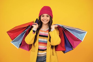 Teenager hold shopping bag enjoying sale. Autumn shopping sale. Child girl is ready to go shopping. Happy teenager, positive and smiling emotions of teen girl