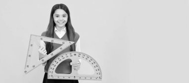 cheerful teen girl study math with protractor and triangle measuring size, back to school. Banner of school girl student. Schoolgirl pupil portrait with copy space