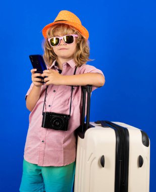 Kid on travel, isolated studio portrait. Child travel and adventure concept