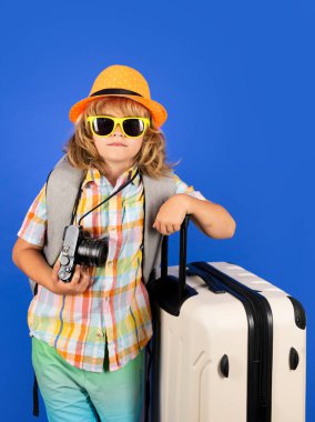 Kid on travel, isolated studio portrait. Child travel and adventure concept