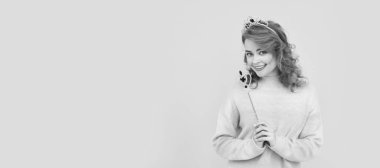 happy redhead woman in queen crown with magic wand, wish. Woman isolated face portrait, banner with copy space