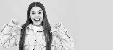 happy kid girl wear pink checkered shirt pointing fingers on herself, selfish. Child face, horizontal poster, teenager girl isolated portrait, banner with copy space