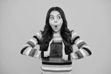 Shocked amazed face, surprised emotions of young teenager girl. Cute teenager child girl congratulate with valentines day, giving romantic gift box. Present, greeting and gifting concept