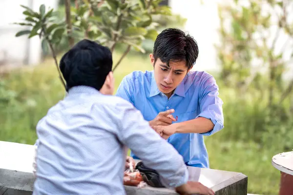 stock image A guy scolds and blames someone for being late. Men getting scolded for being late