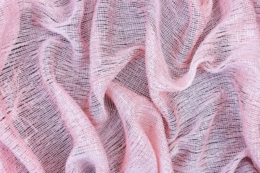 Pembe parlak kumaş arka planı dalgalı kıvrımlar halinde katlandı.