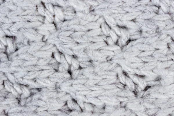 stock image Texture of white warm knitted sweater close up.